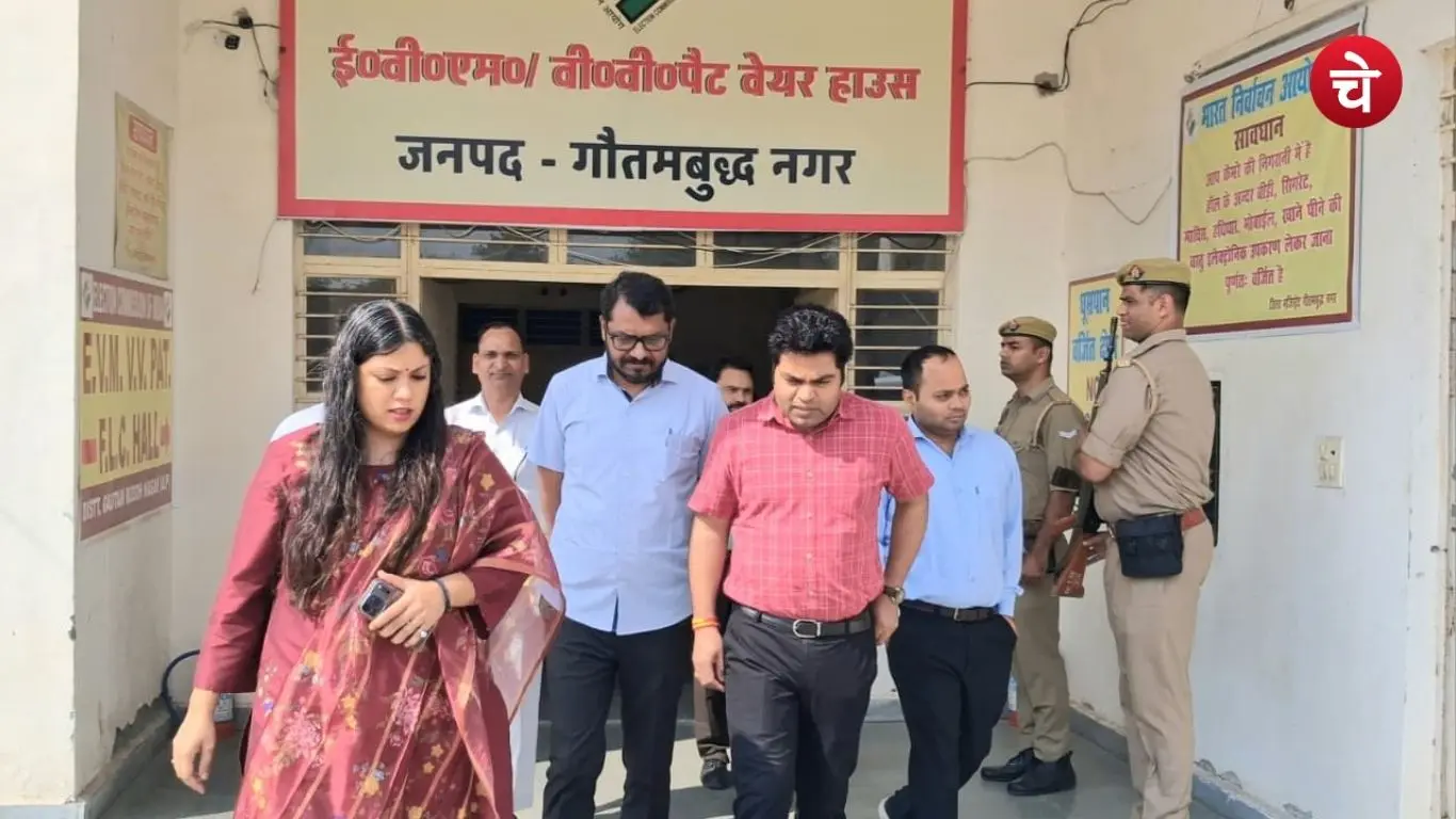 DM Medha Rupam and other administrative officials during an inspection of the EVM-VVPAT warehouse